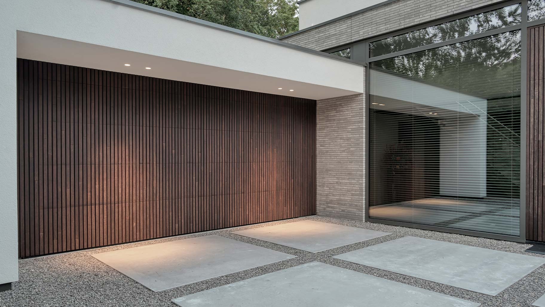 Different Doors concealed garage door and front door in MOSO Bamboo