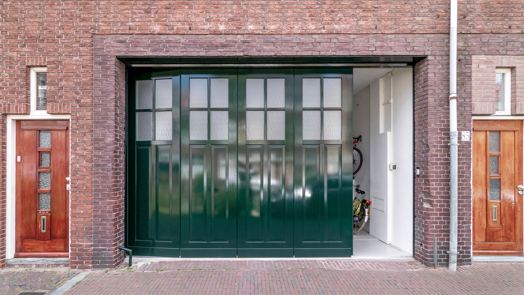 Side-sliding garage door at a canal house