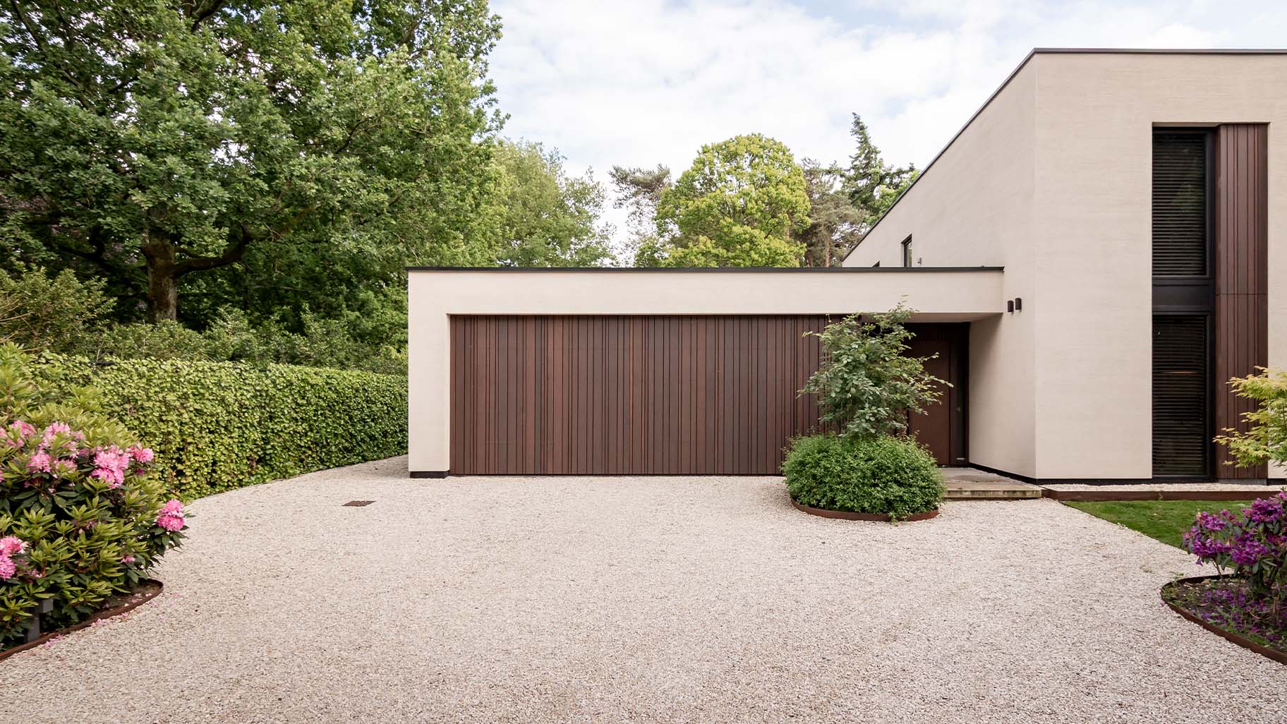 Wooden garage door with dark finish