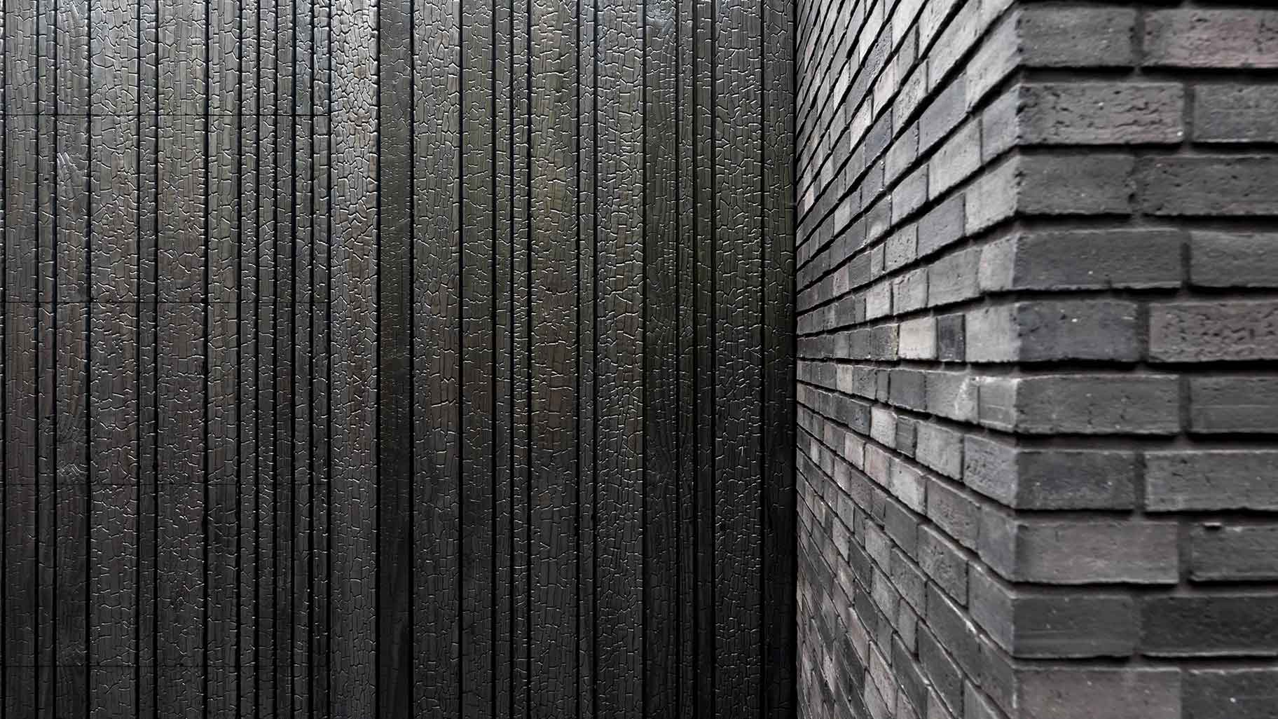 Wooden garage door made of Shou Sugi Ban (charred wood using a Japanese technique)