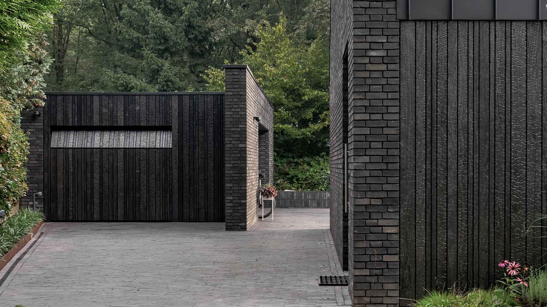 Wooden garage door made of Shou Sugi Ban (charred wood using a Japanese technique)