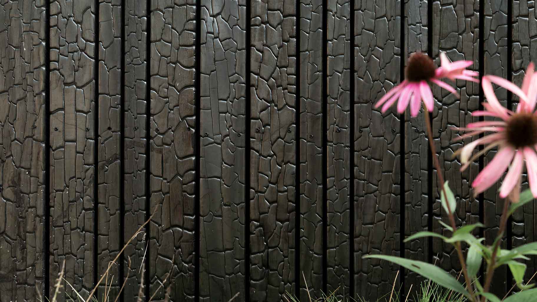 Wooden garage door made of Shou Sugi Ban (charred wood using a Japanese technique)