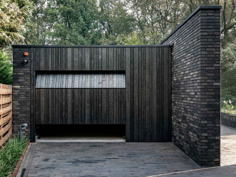 Wooden garage door made of Shou Sugi Ban (charred wood using a Japanese technique)