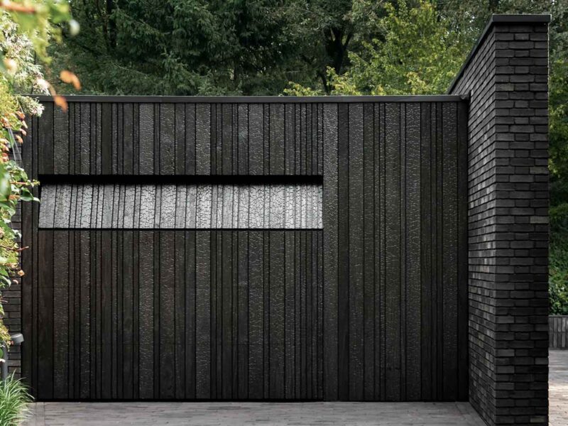 Wooden garage door made of Shou Sugi Ban (charred wood using a Japanese technique)