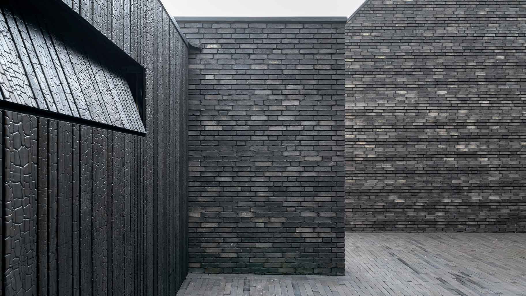 Wooden garage door made of Shou Sugi Ban (charred wood using a Japanese technique)