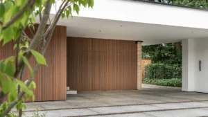 Side sliding garage door made of Fraké wood