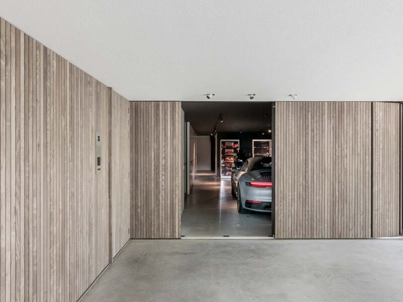 sideways wooden garage door with a pedestrian door