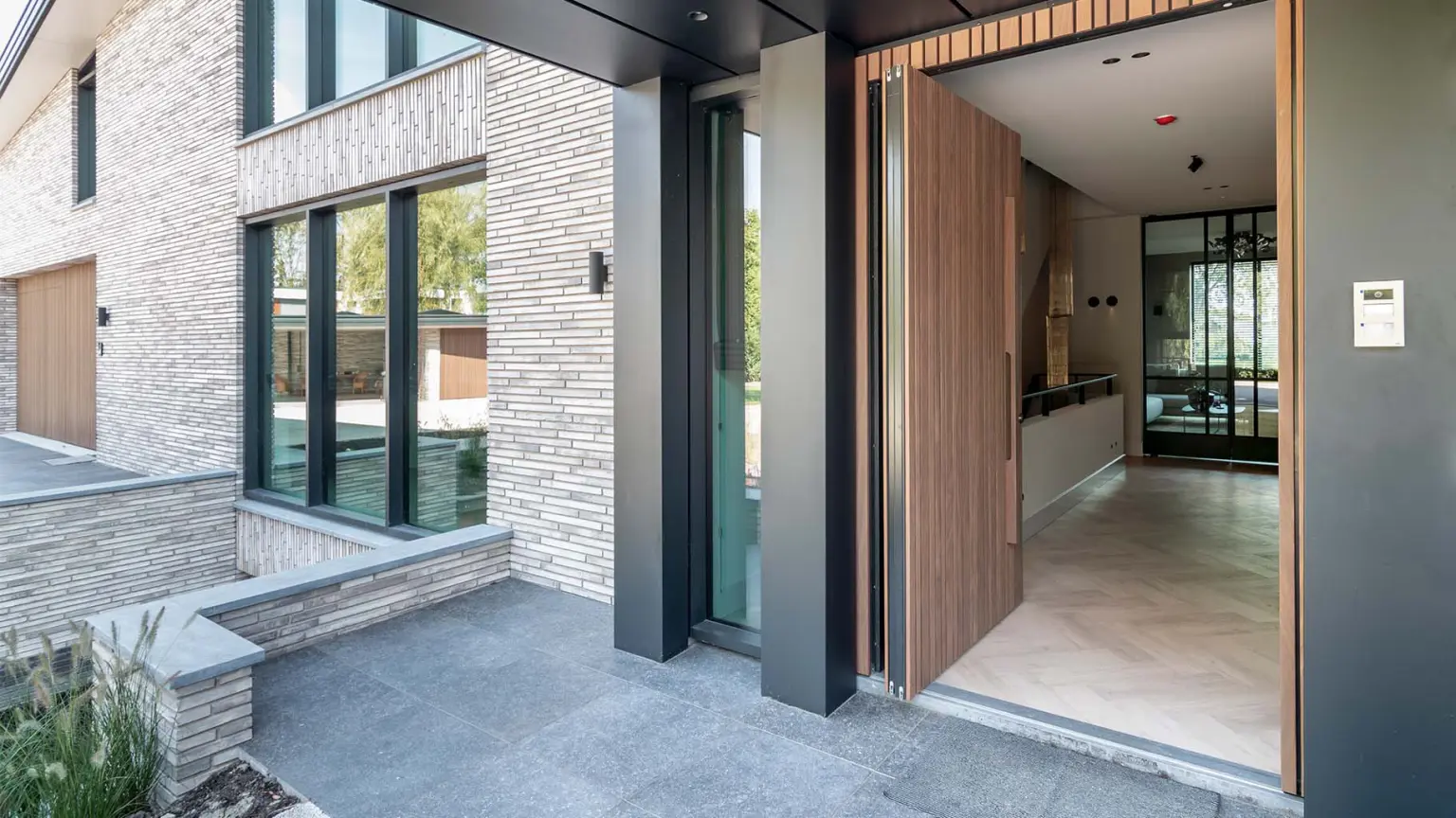 wooden-pivot-door-two-garage-doors-and-walk-through-door-different-doors