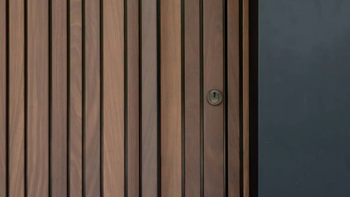wooden-pivot-door-two-garage-doors-and-walk-through-door-different-doors