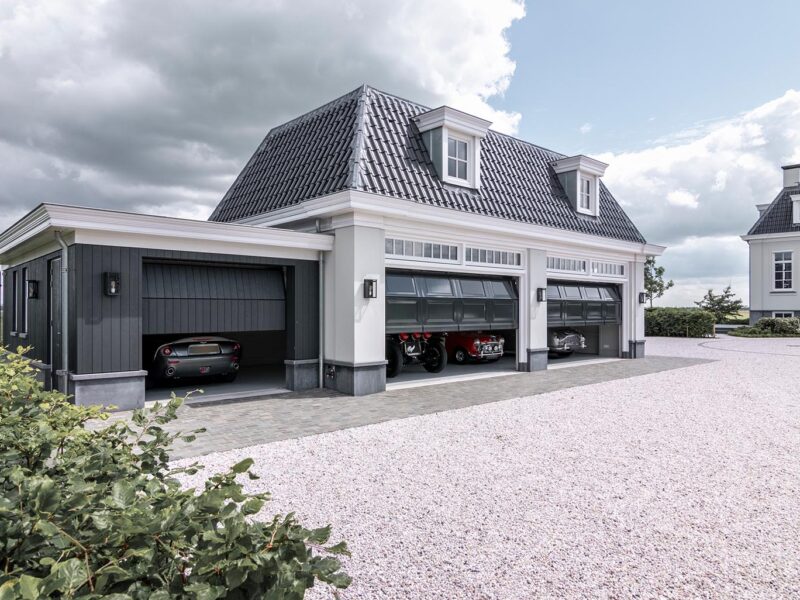 Classic-style garage doors for an estate with a villa - Different Doors
