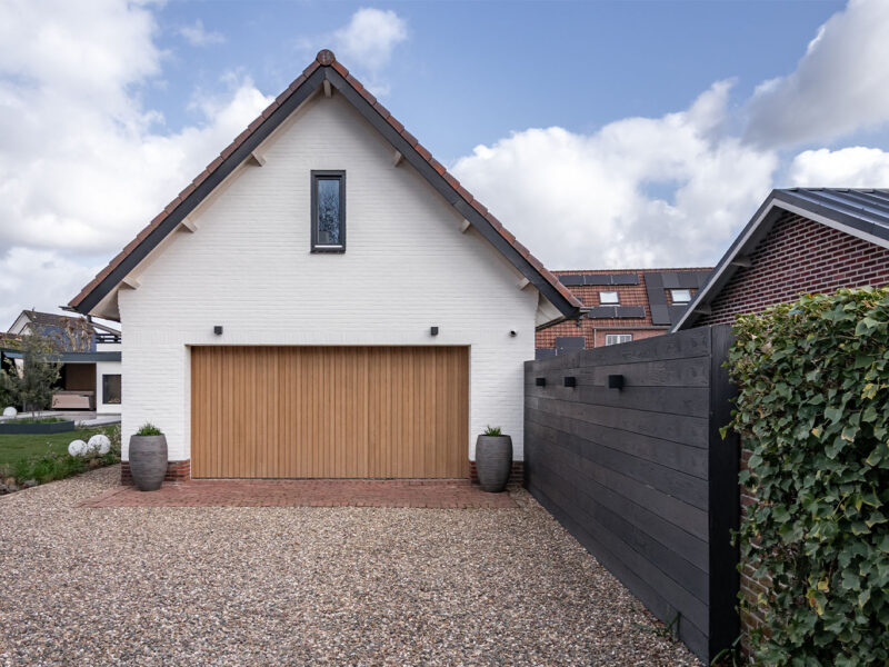 Side sliding garagedoor made of Millboard